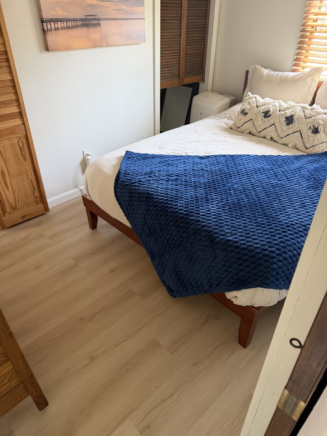 Clean hallway leading into a bedroom