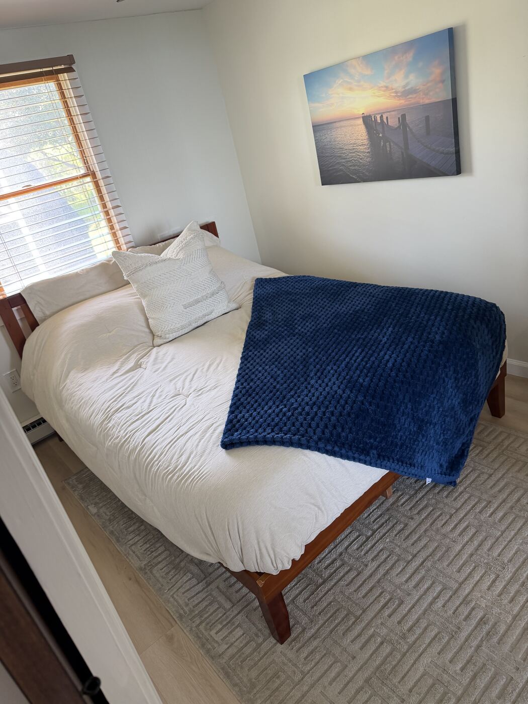 Tidy living space with heater and seating